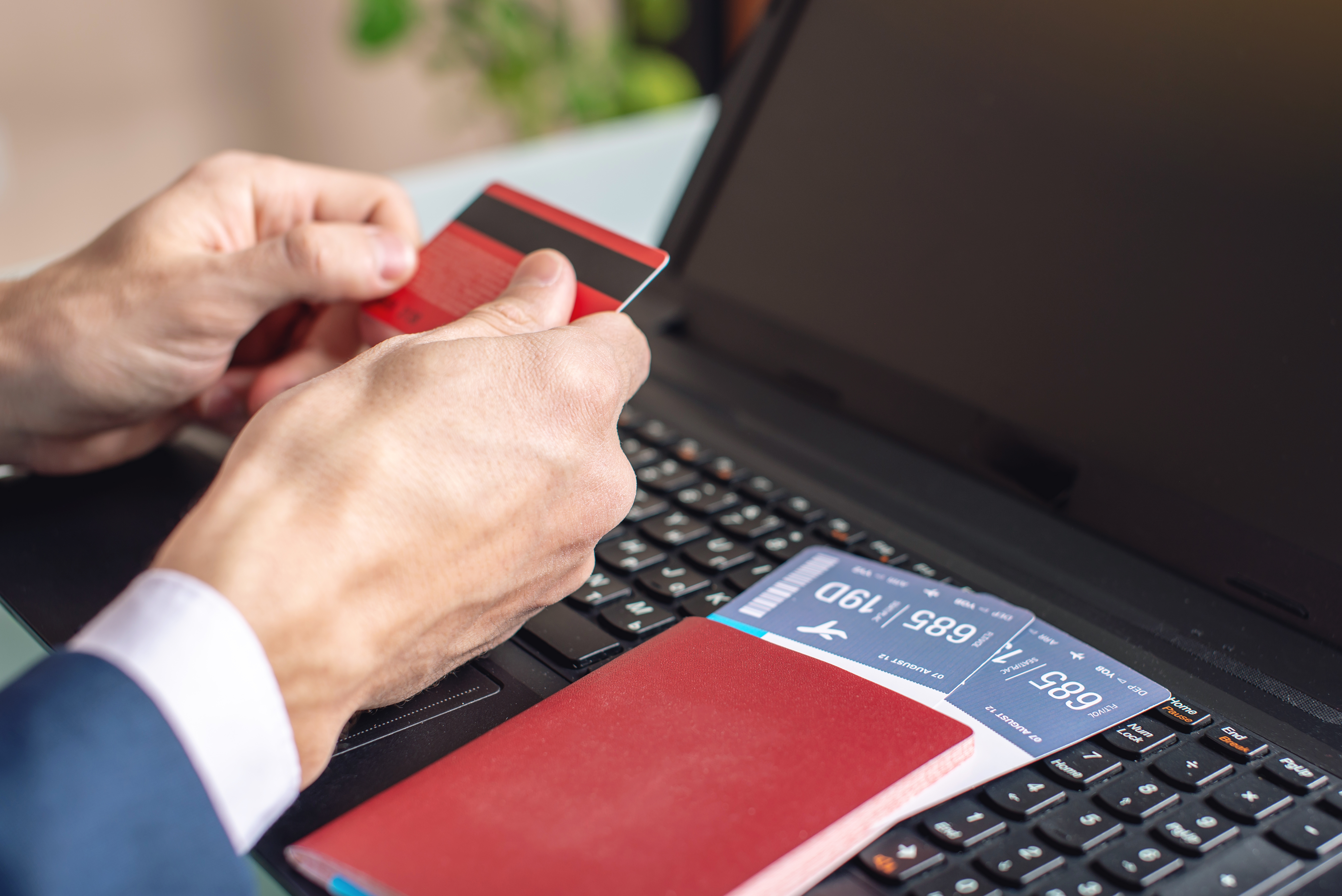 Man,Holding,Debit,Card,In,Hand,Buying,On,The,Internet